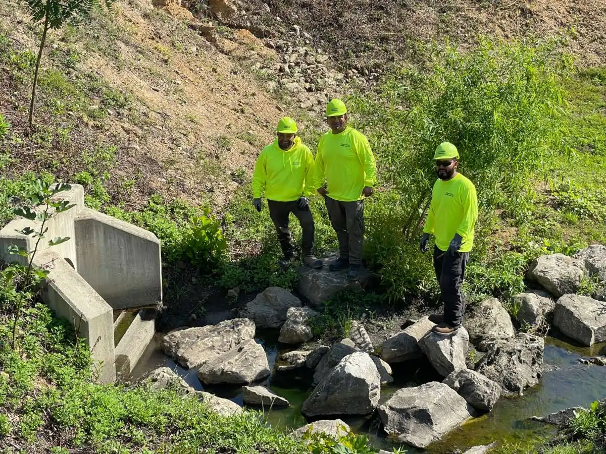 philadelphia water logs team smiling near basin